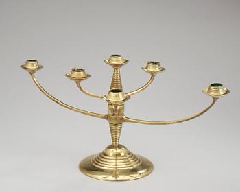 A brass candelabrum after Bruno Paul, Germany, early 20th C.
