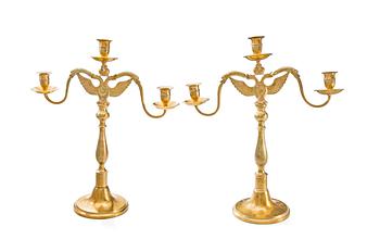 A pair of three light bronze candelabras made by Leander Helander, Tilvik, Kalajoki, Finland.