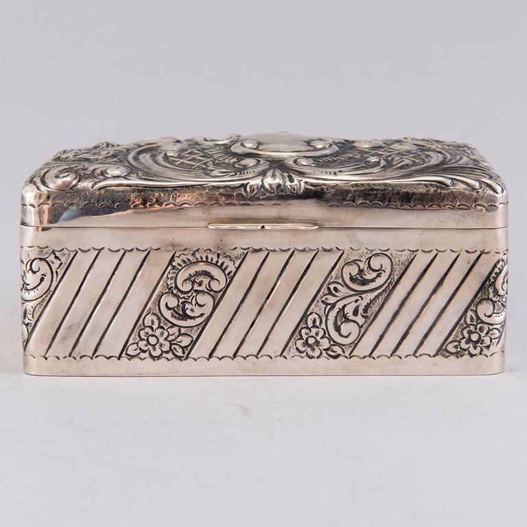 A silver cigar box, mark of A. & J. Zimmerman, Birmingham 1897.