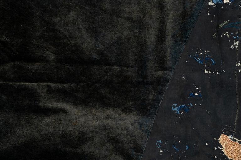 An embrodiered textile with a five clawed dragon, lined with yellow silk, Qing dynasty.