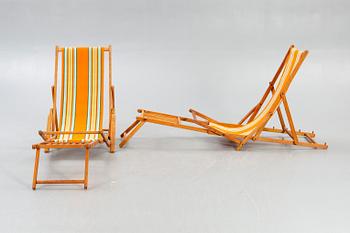 Sun loungers, a pair of footstools, 1950s.