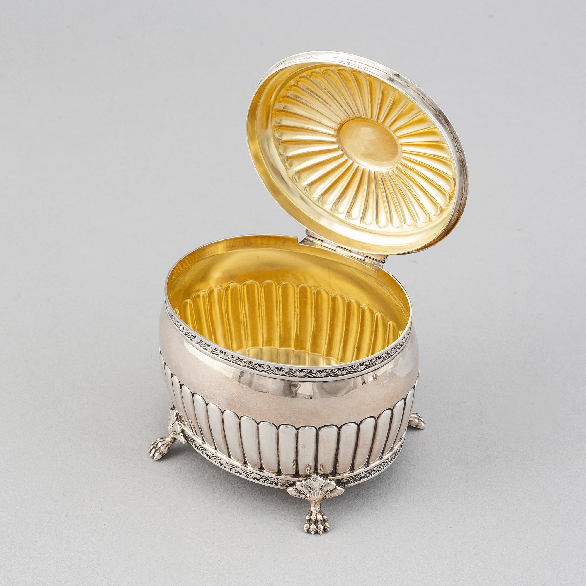 A silver creamer by Johan Petter Ahlforss, Strängnäs, 1833 and a silver sugar box, Kristianstad, 1928.