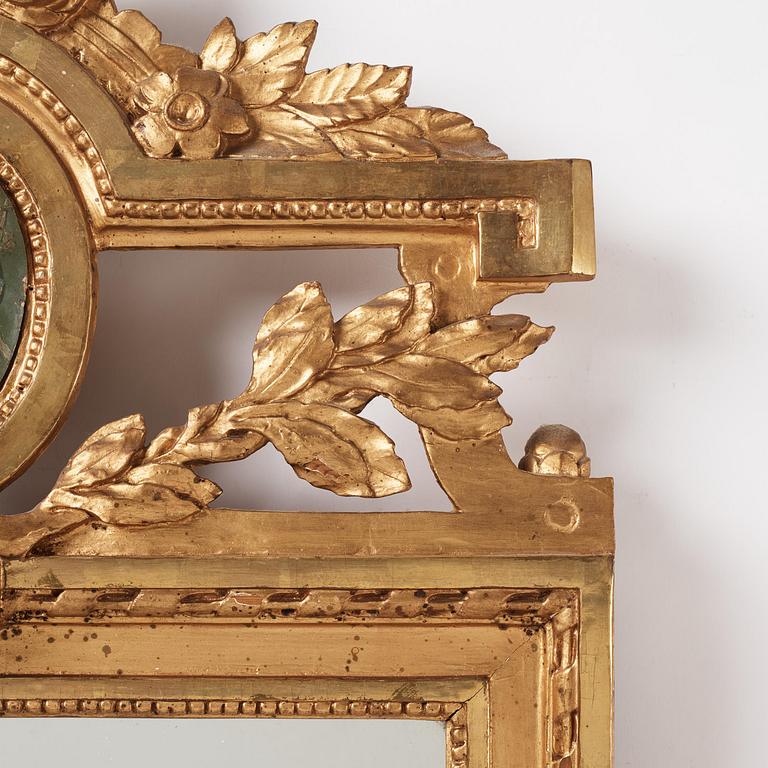 A Gustavian giltwood two-branch girandole mirror, Stockholm, late 18th century.