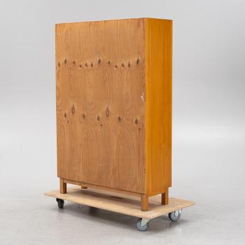 An oak veneered cabinet. 20th Century.