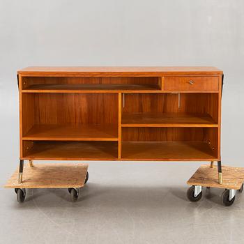 A mid 1900s teak counter.