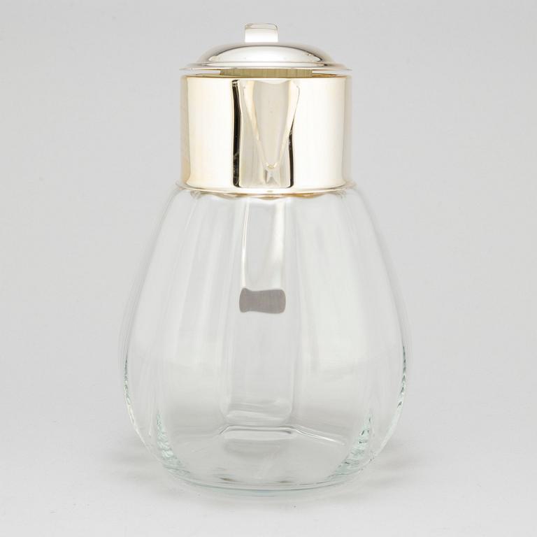 A glass and metal jug, second half of the 20th century, purchased from Firma Svenskt Tenn.