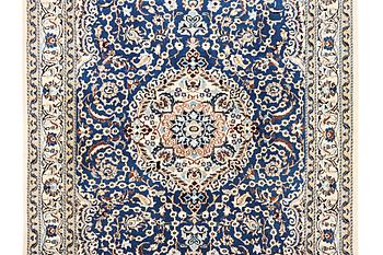 A Nain carpet, part silk, 9 laa, c. 300 x 189 cm.