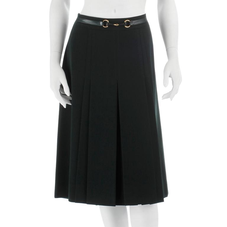 CÉLINE, a green wool skirt, size 48.