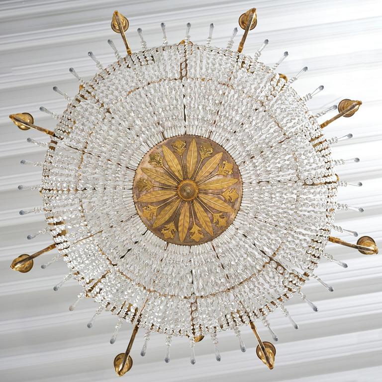 An ormolu and cut glass sixteen-branch Empire chandelier, Paris, early 19th century.