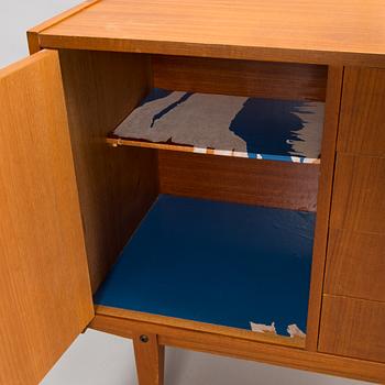 A mid-20th century bookshelf.