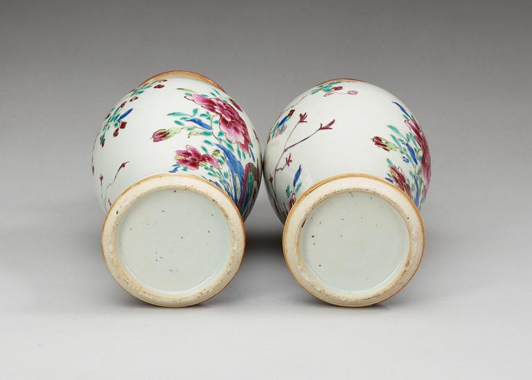 A pair of famille rose vases with covers, Qing dynasty (1736-95).