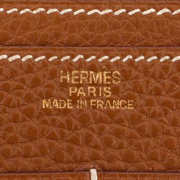 HERMÈS, a brown leather wallet, "Dogon Dou".