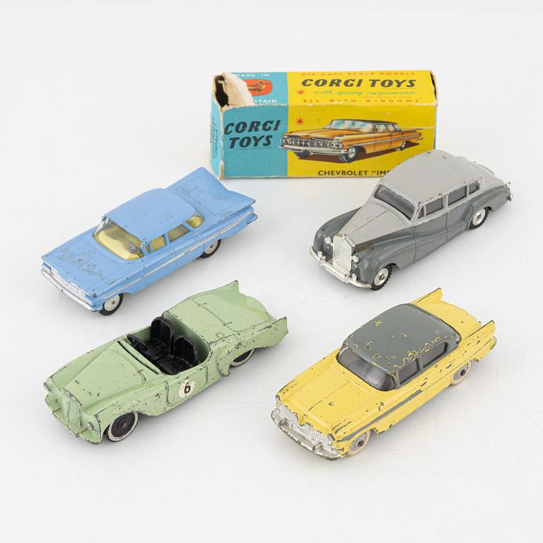 Nine toy cars, mostly Dinky toys.