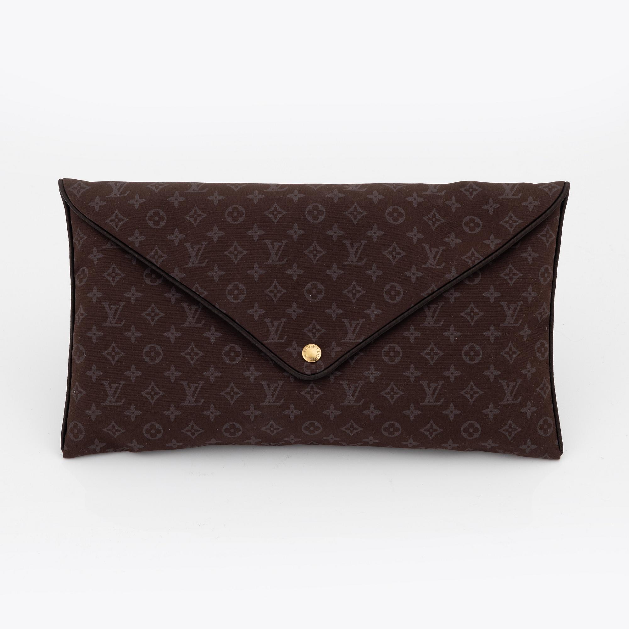 Louis Vuitton, a monogram "Trousse kit de voyage' travel kit with inflatible pillow and eye mask.