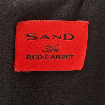 SAND red carpet, a sequin embellished dress.
