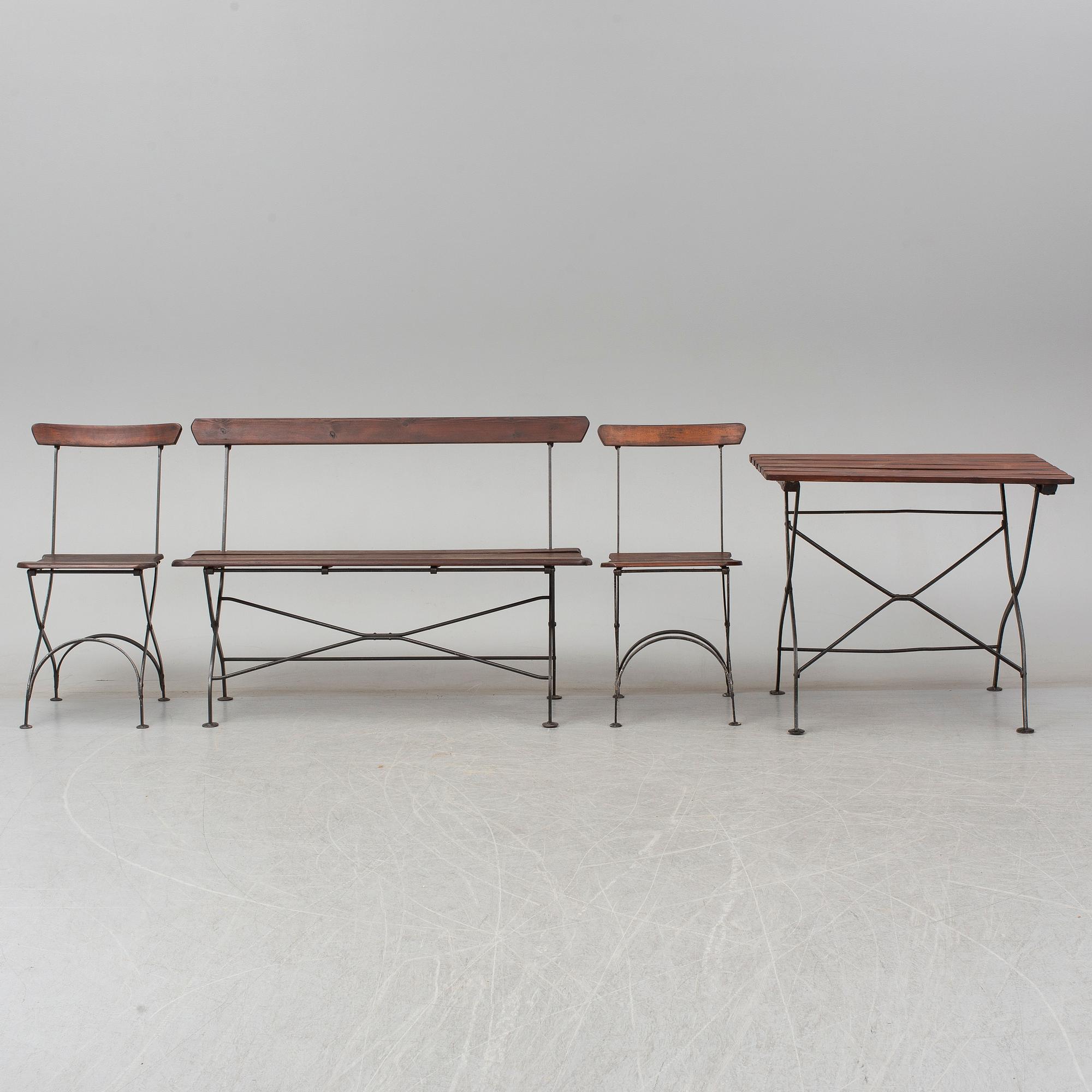 A garden sofa, table and a pair of chairs, first half of the 20th century.
