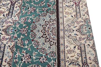 A Nain carpet, part silk, 6 laa, ca. 300 x 201 cm.