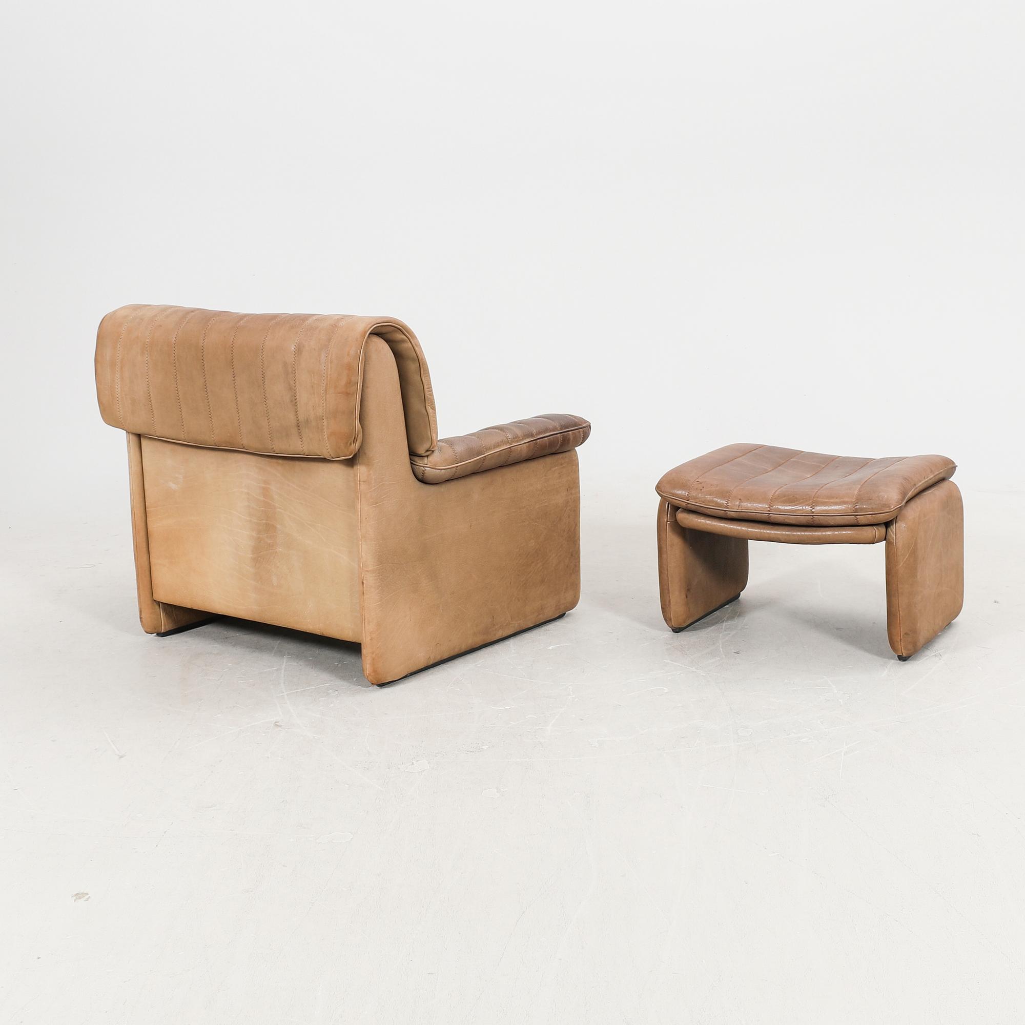 A leather armchair and fotstool by De Sede, Schweiz second half of the 20th century.