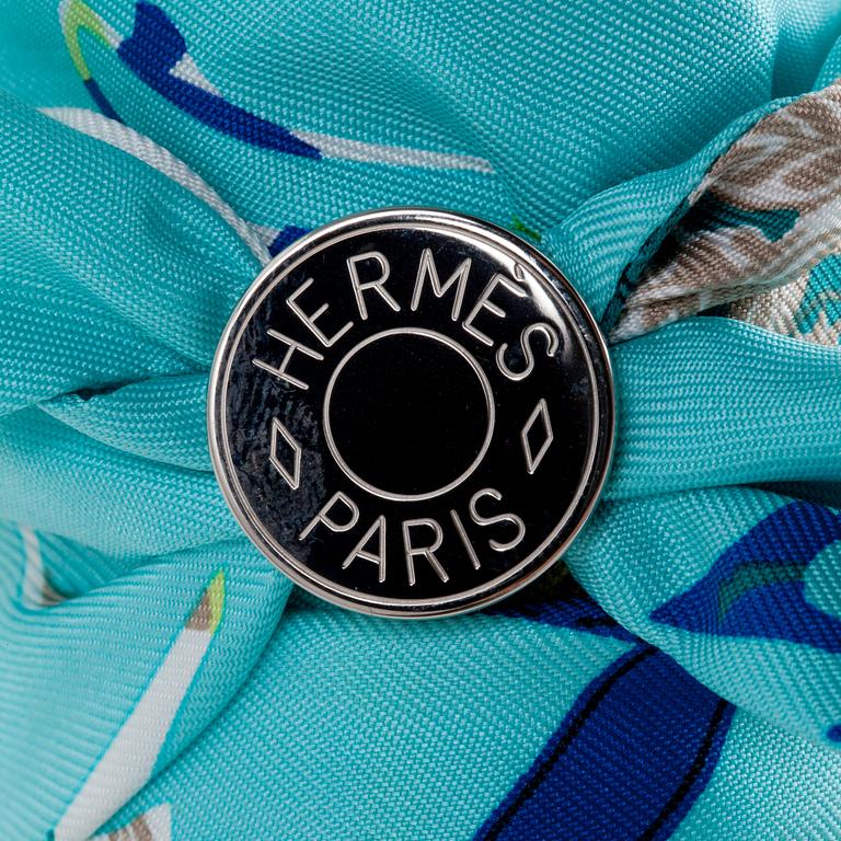 HERMÈS, two silk braclets with palladiumcovered locks.