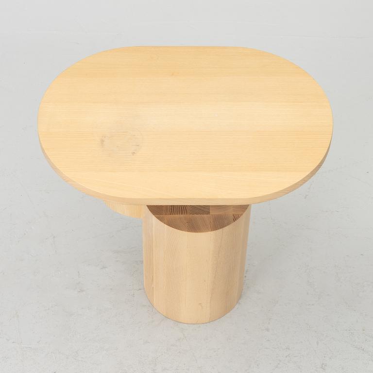 An 'Insert' side table, Firm Living.