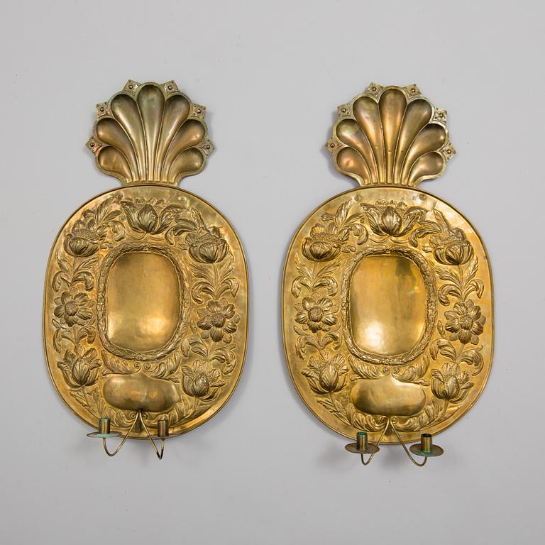 a pair of brass wall plates by Johan F. Hellström, Nyköping, 1901.