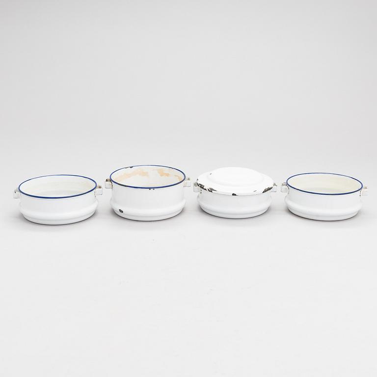 A set of 7 enamelled metal serving dishes. Kockums emaljverk and Finel.