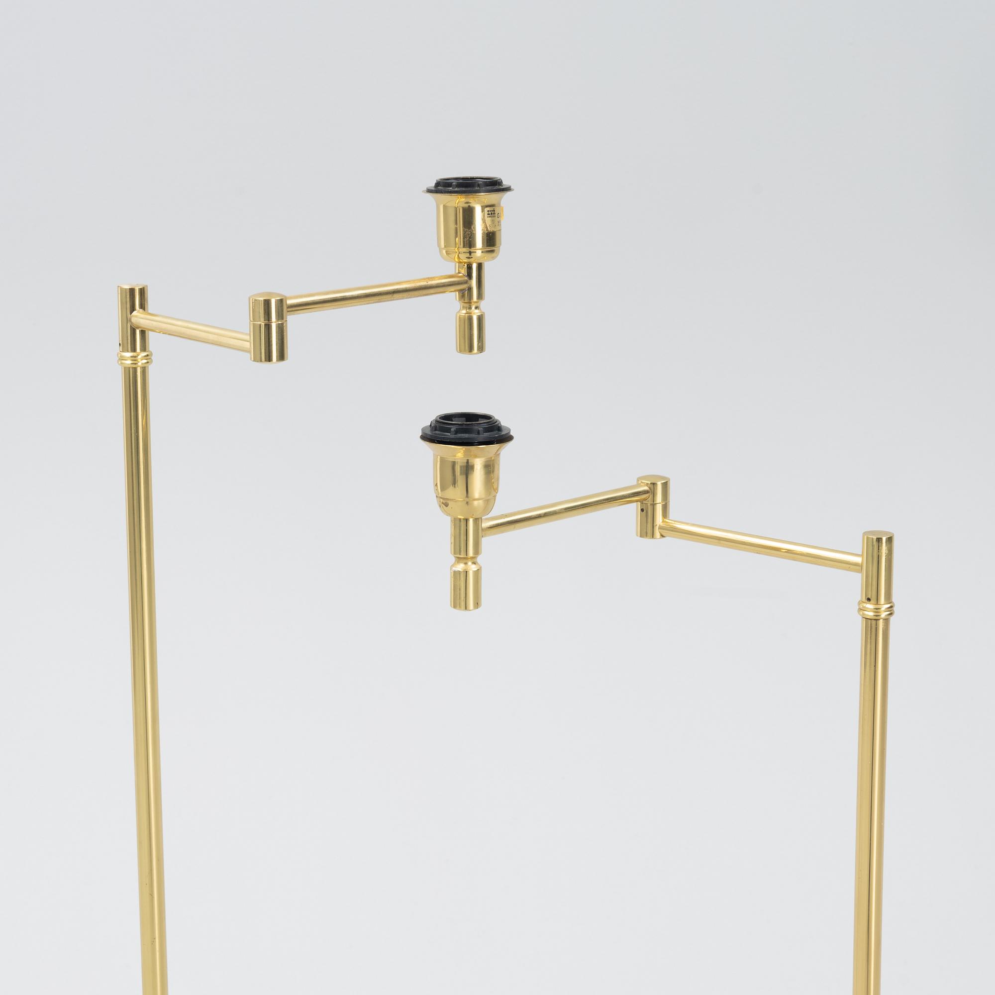 A pair of brass floor lamps, EWÅ, Sweden, second half of the 20th century.