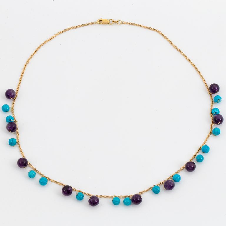 Carved turquoise and amethyst bead necklace.