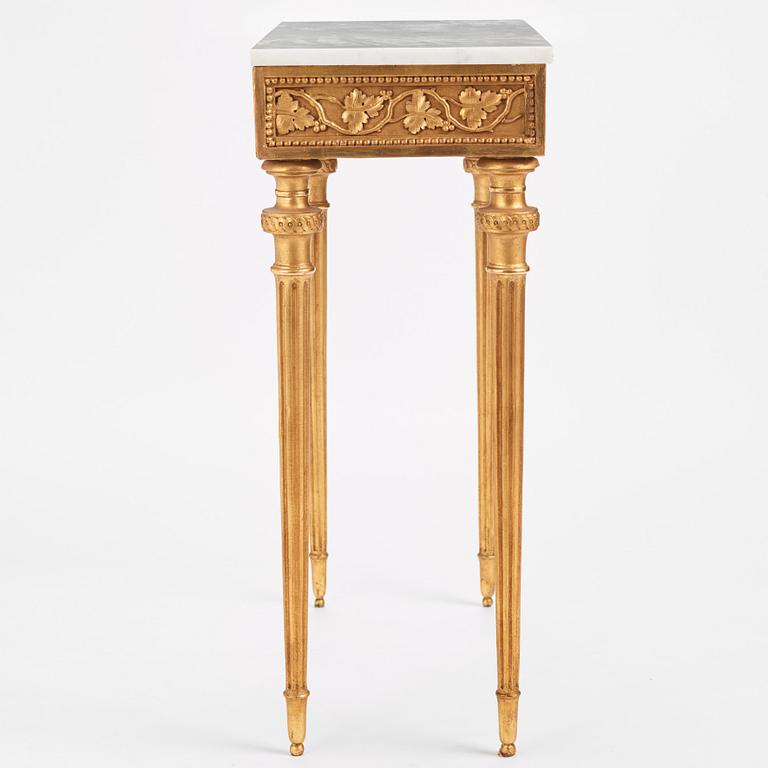 A late Gustavian carved giltwood and marble console table attributed to P. Ljung (1743-1819).