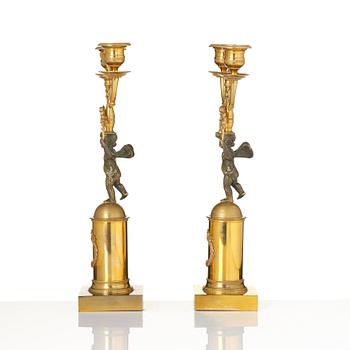 A pair of Empire gilt-brass two-branch candelabra, Stockholm, early 19th century.
