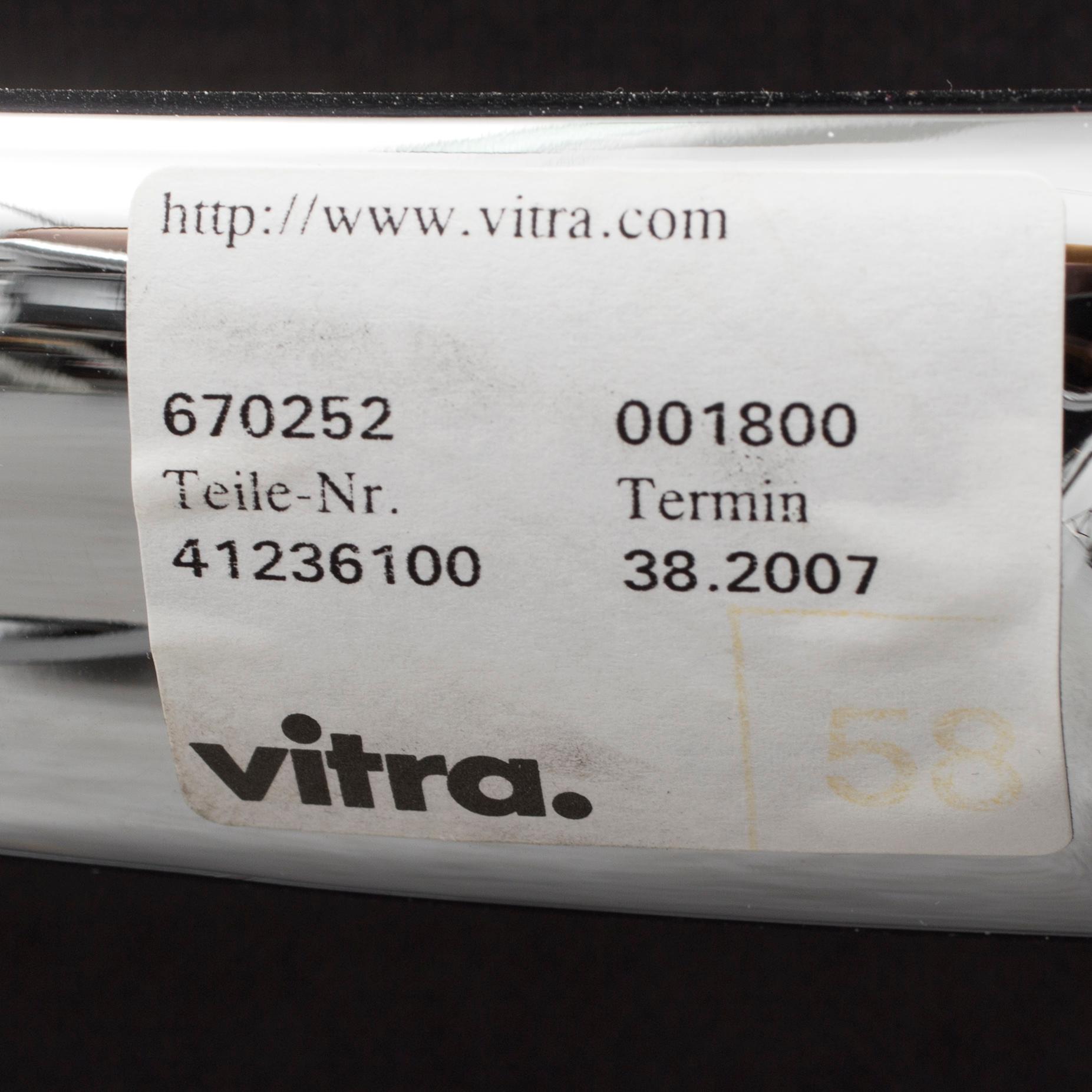 An 'EA 104 Swivel' armchair by Charles & Ray Eames, Vitra, 2007.