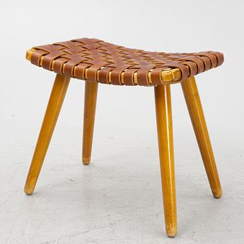 A mid 20th century birch stool with leather.