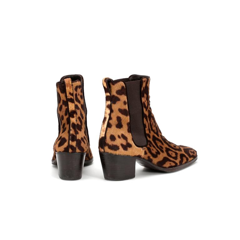 YVES SAINT LAURENT,  a pair of leopard leather boots.
