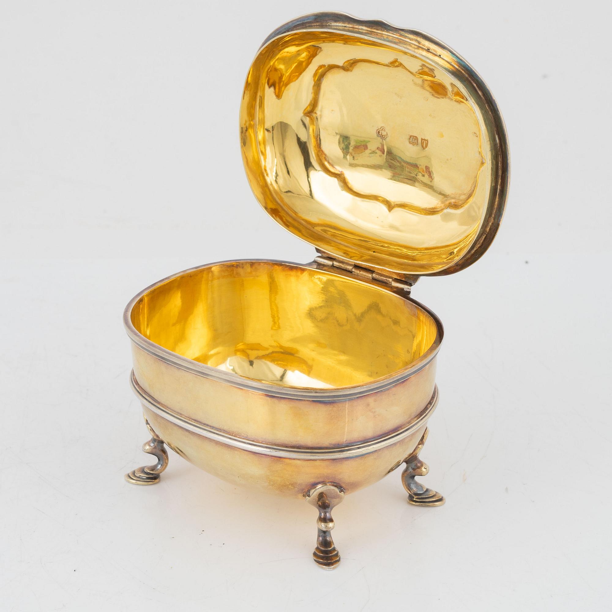 A parcel-gilt silver sugar box, Carrington & Co, London, England, 1894.