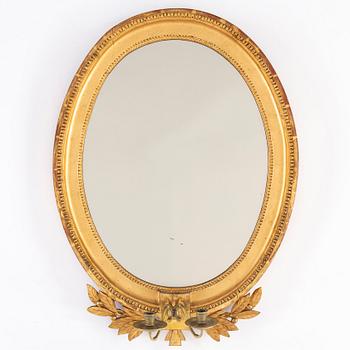 A late Gustavian two-light girandole mirror, circa 1800.