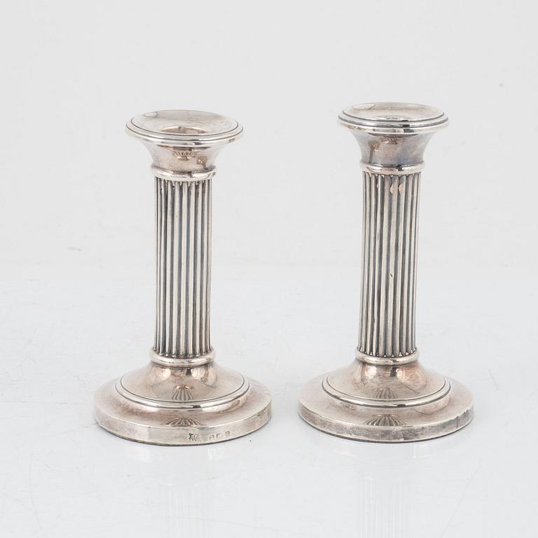 A pair of silver candlesticks, Boots Pure Drug Company, Birmingham, England, 1905-1909.