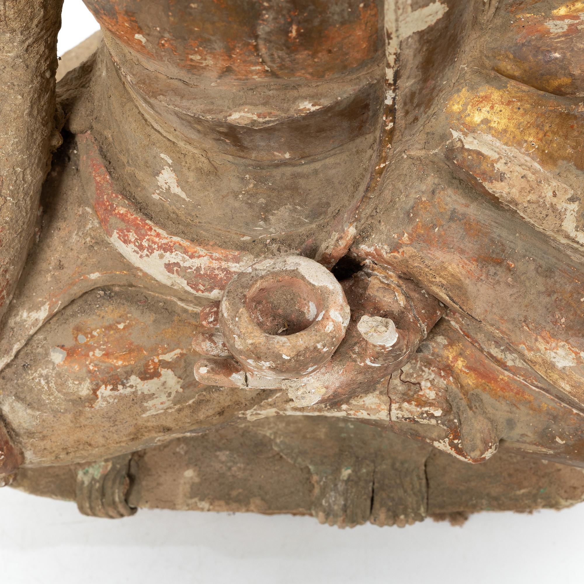 A Southeast Asian figure of a Buddha, 20th century.
