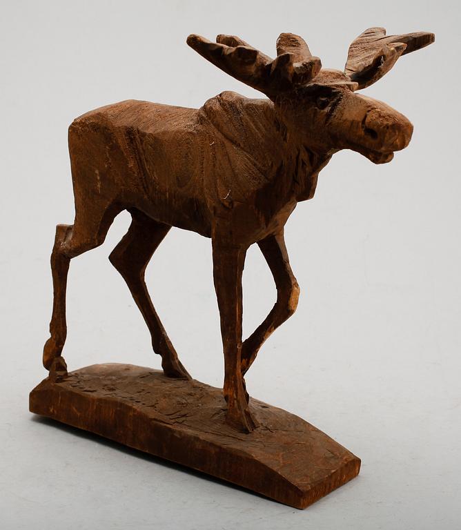 ERIK REIMHULT, figur, skuret trä, sign och dat 75.