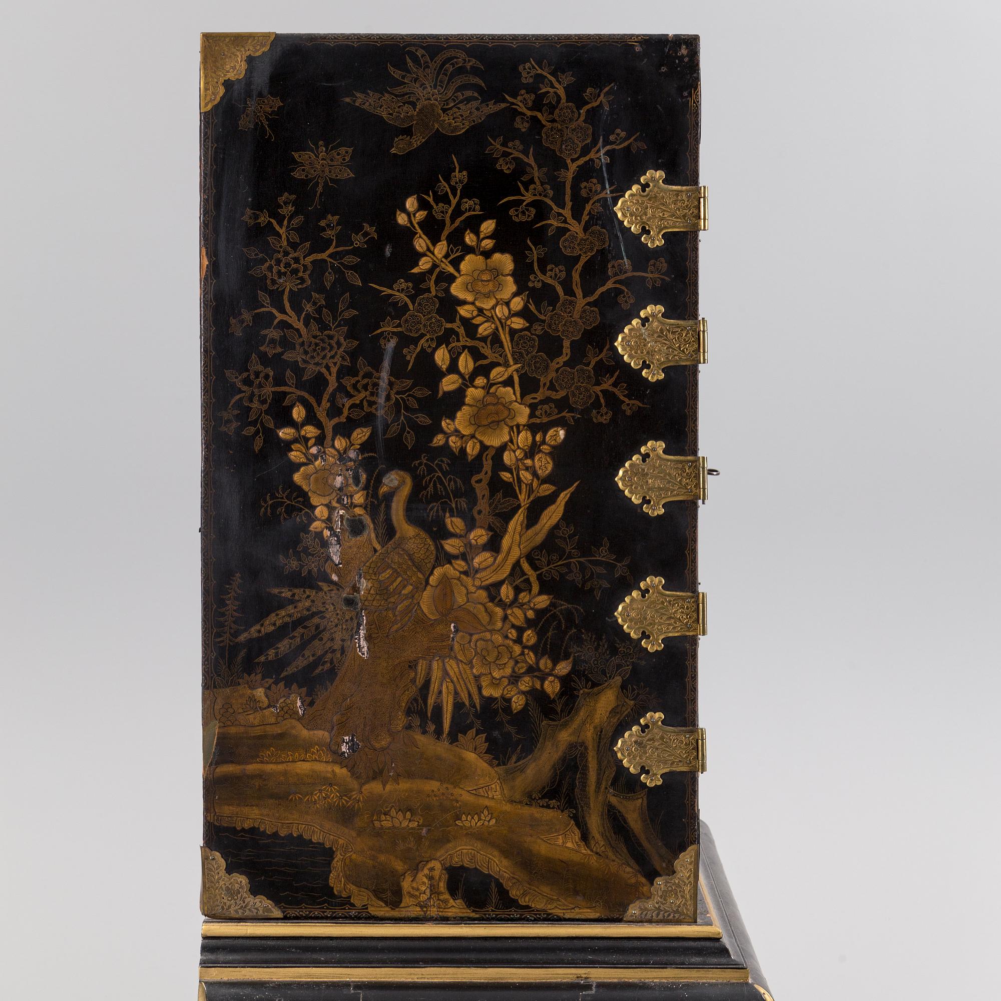 AN early 18TH CENTURY PROBABLY ENGLISH Japanned laquer cabinet on stand.