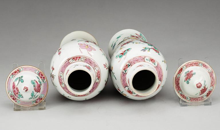 A pair of famille rose 'rooster' vases with covers, Qing dynasty, Qianlong (1736-95).