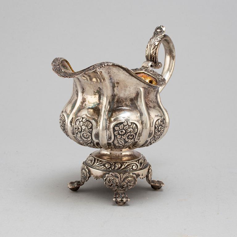 A Russian parcel-gilt silver creamer,  1842, probably Moscow.