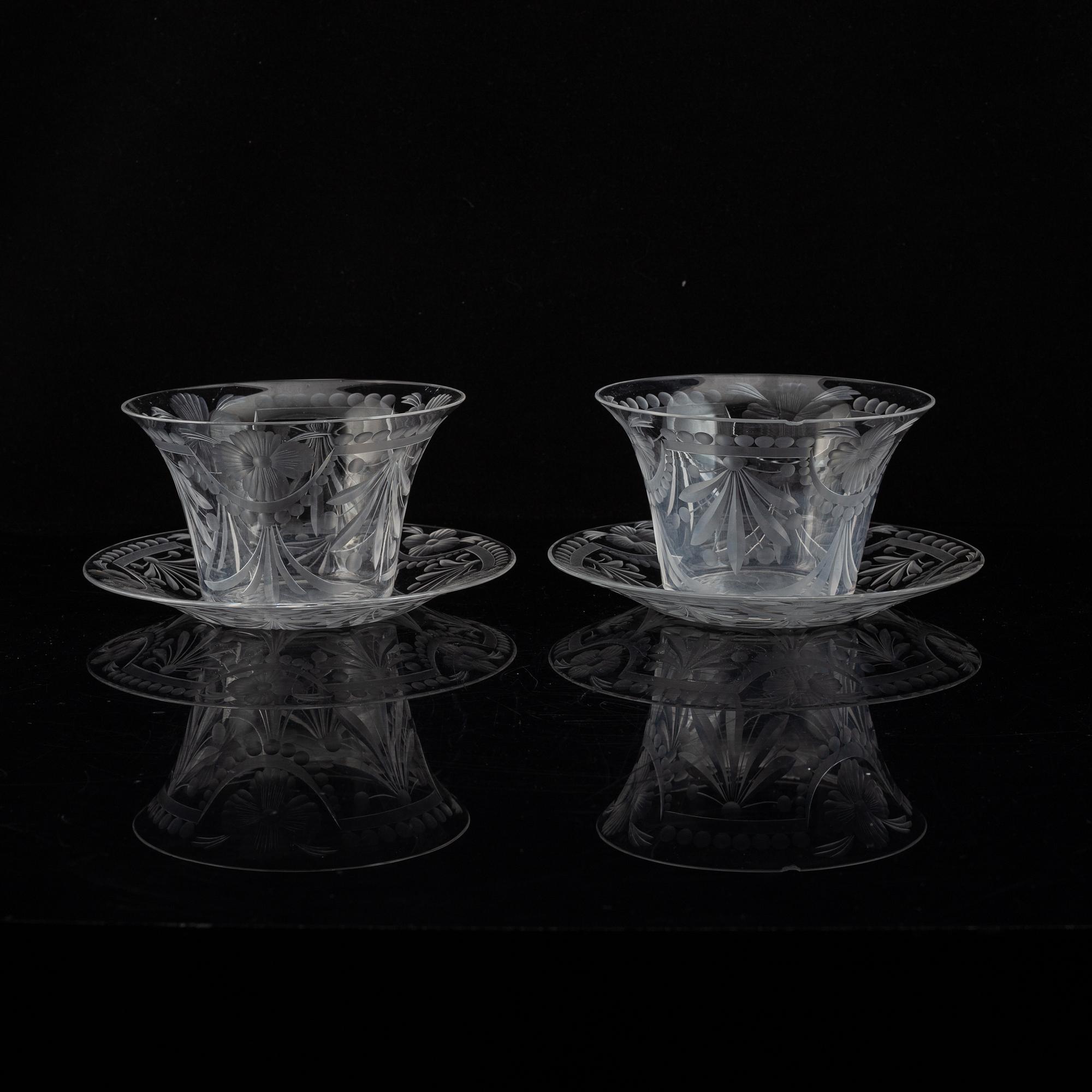 A pair of glass bowls with dishes, 20th century.