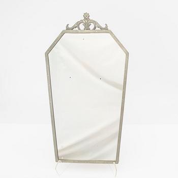 Spegel med lampetter 1900-talets första hälft.