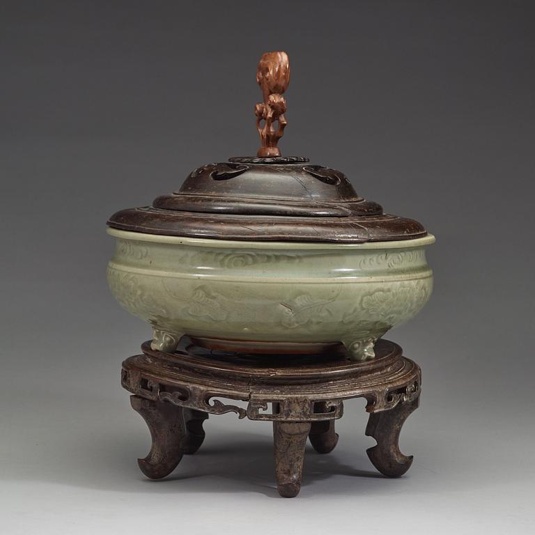 A large tripod celadon censer, presumably late Ming dynasty (1368-1644).