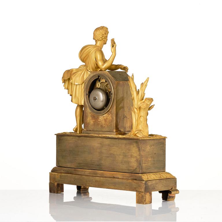 A French Empire ormolu and patinated bronze mantel clock, Paris, early 19th century.