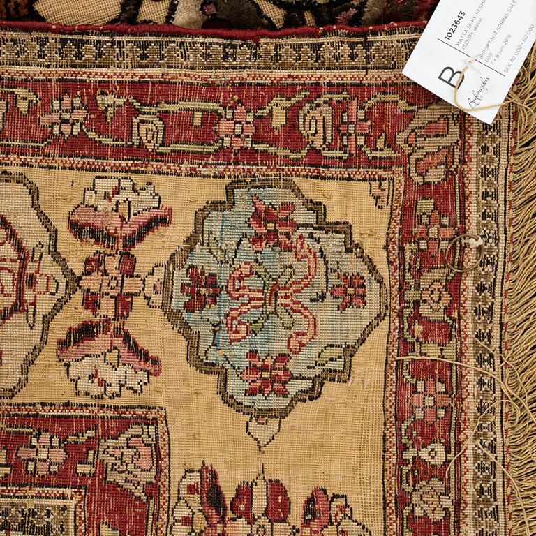 A RUG, a semi-antique silk Kashan relief (souf), ca 202 x 130,5-133 cm.