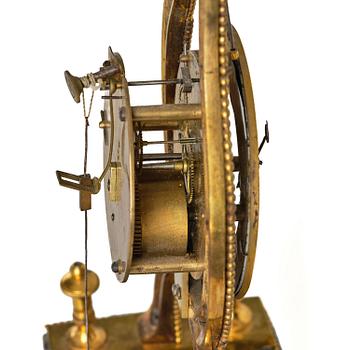 A French Louis XVI ormolu and marble lyre-shaped mantel clock, late 18th century.