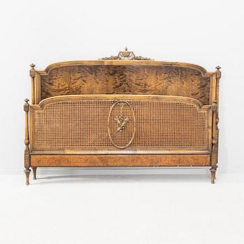 A Louis XVI style brich and rattan bed first half of the 20th century.