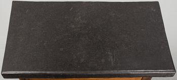 A 19th Century Baroque style table with a stone top.