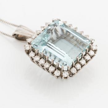 An 18K white gold Engelbert pendant set with a aquamarine and round brilliant-cut diamonds.